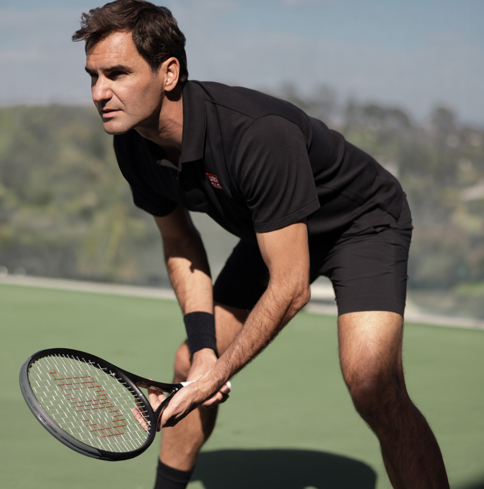 Federer playing tennis
